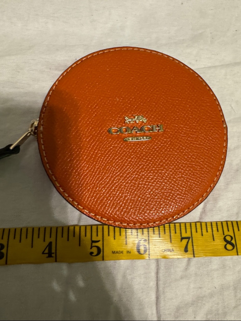 Coach Round Pebbled Leather Coin Pouch in Bright Orange with Gold Logo